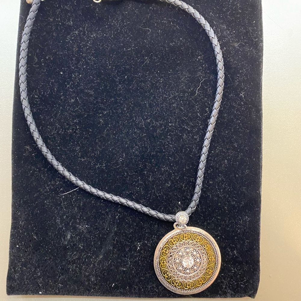 Lia Sophia medallion with black leather band.